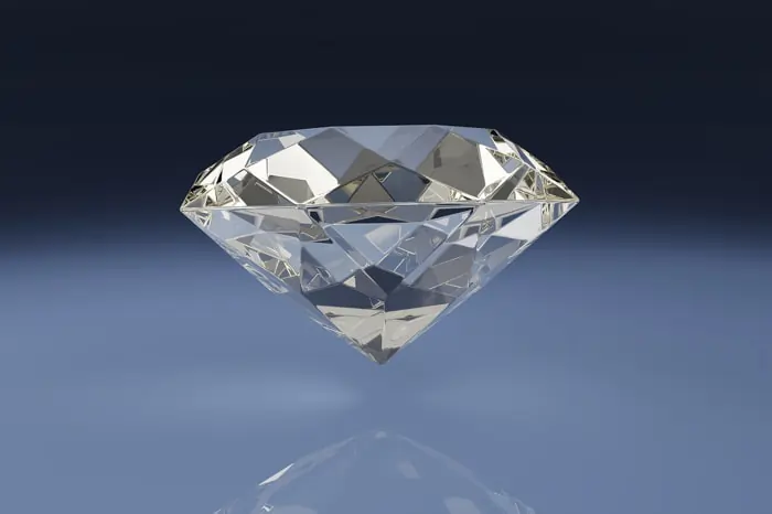 Diamante in primo piano su sfondo chiaro scuro | Accademia delle Arti Orafe
